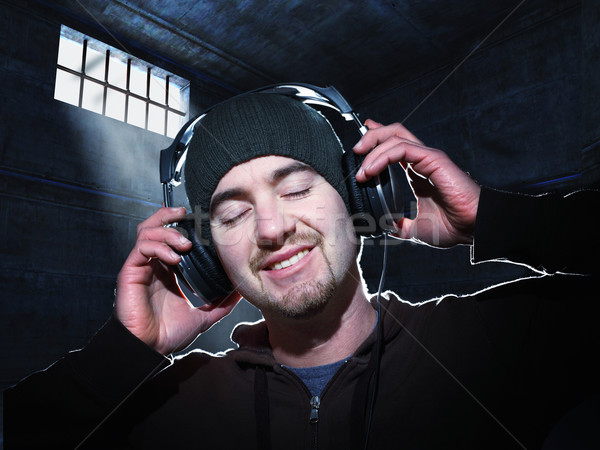 Kaçış portre adam dinlemek müzik hapis Stok fotoğraf © tiero