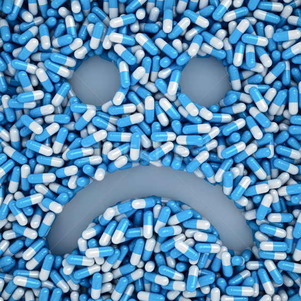 Unwohl Lächeln traurig viele blau Pillen Stock foto © timbrk