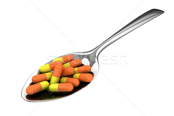 Medical doza argint lingură pastile izolat Imagine de stoc © timbrk