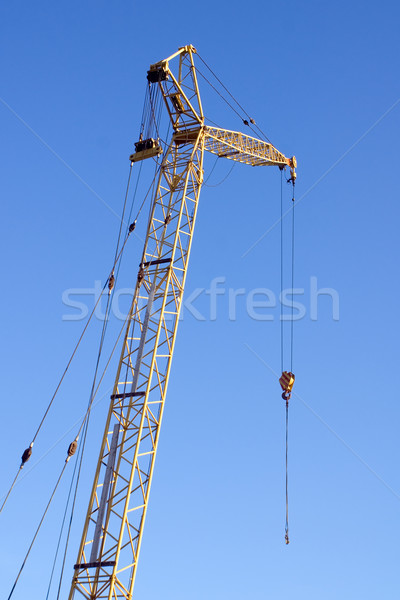 Guindaste blue sky amarelo edifício construção quadro Foto stock © timbrk