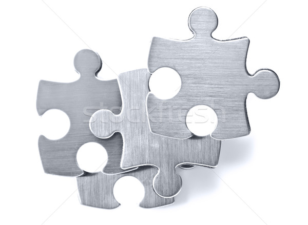 Stainless steel puzzle pieces on white background Stock photo © tish1