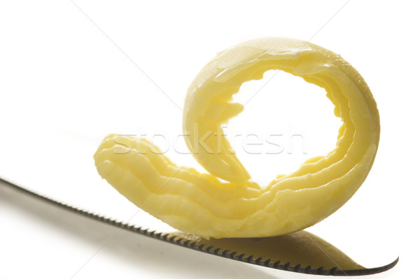 Butter on knife tip on white Stock photo © tish1
