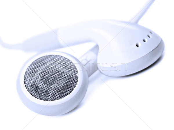 Stock photo: Macro close up of white earphones - very shallow depth field