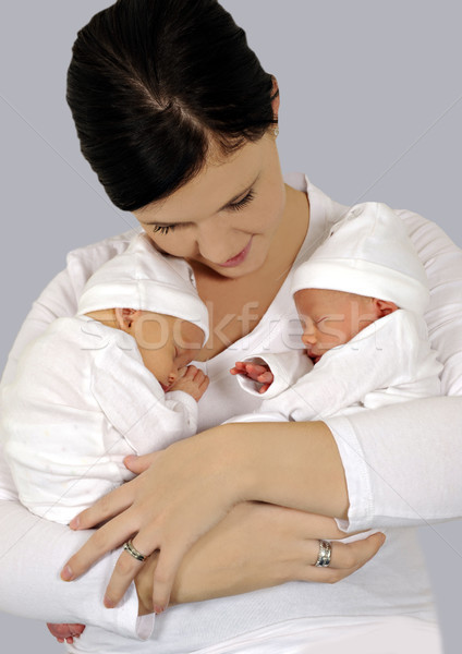 Young mother with twin babies in white clothing Stock photo © tish1