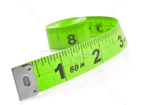 Tape measure on a white background with space for text Stock photo © tish1