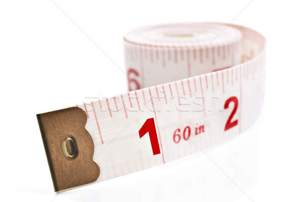 White and red tape measure on a white background Stock photo © tish1