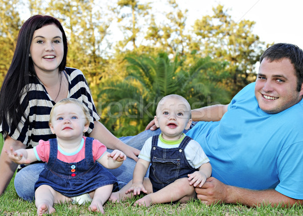 Beautiful young family with twin babies Stock photo © tish1