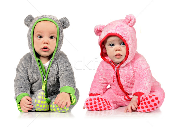 Six month old twin brother and sister on white Stock photo © tish1