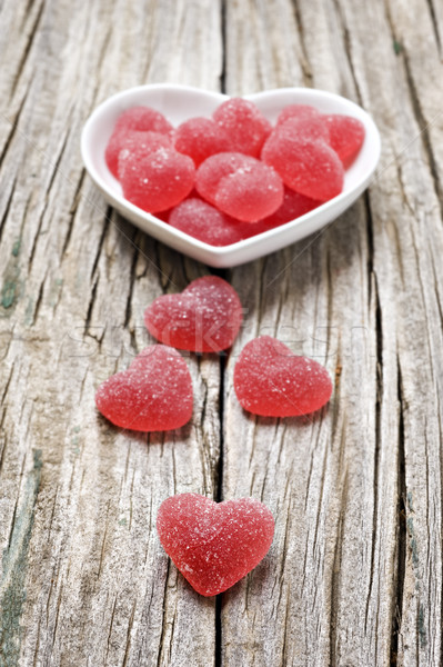 Red heart shaped jelly sweets on wood Stock photo © tish1