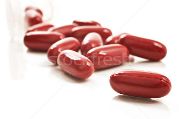 Piros tabletták tabletta üveg fehér boldog Stock fotó © tish1