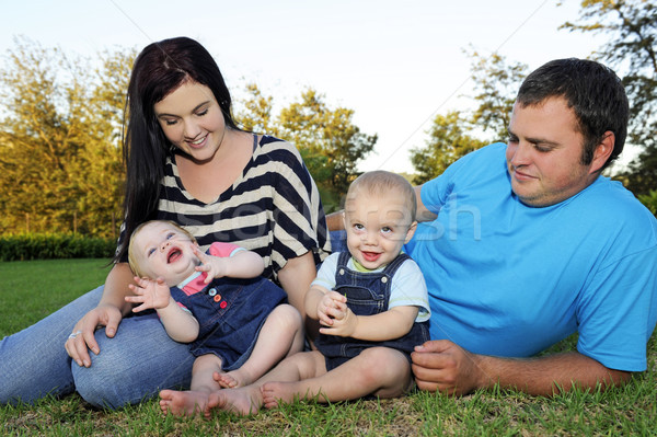 Beautiful young family with twin babies Stock photo © tish1