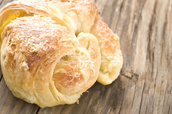 Close up of fresh croissants on a wooden surface Stock photo © tish1