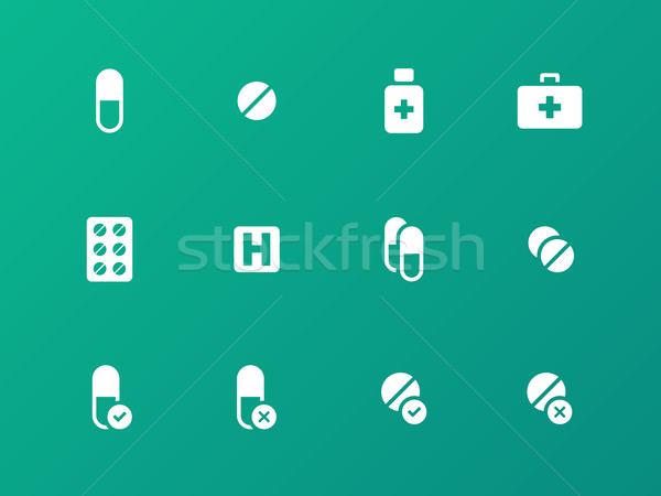 Stock photo: Pills, medication icons on green background.