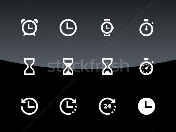 Time and Clock icons on black background. Stock photo © tkacchuk