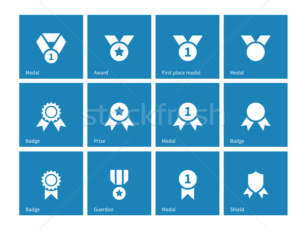 Stock photo: Medal and awards icons on blue background.