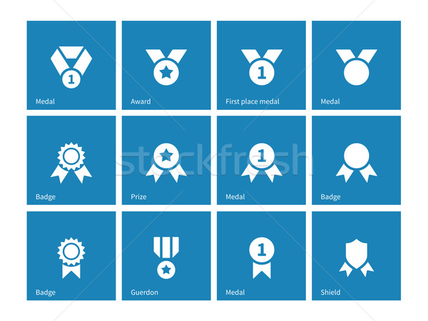 Medal and awards icons on blue background. Stock photo © tkacchuk