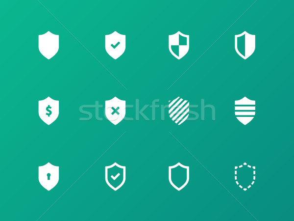 Shield icons on green background. Stock photo © tkacchuk