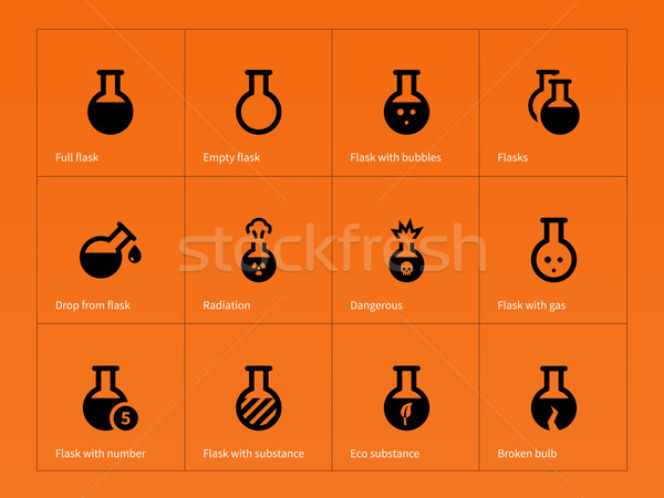 Stock photo: Science flask icons on orange background.