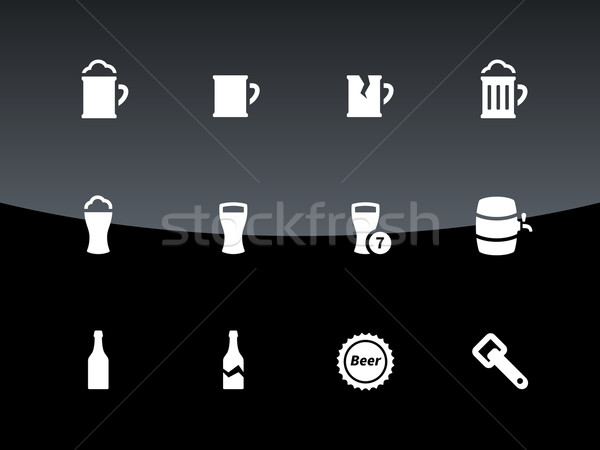 Bottle and glass of beer icons on black background. Stock photo © tkacchuk