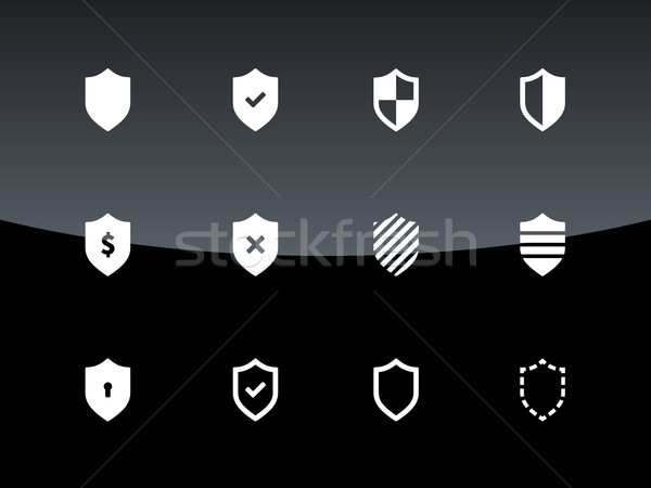 Shield icons on black background. Stock photo © tkacchuk