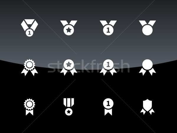 Stock photo: Awards and medal icons on black background.