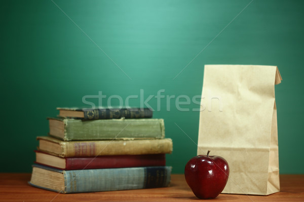 Books, Apple and Lunch on Teacher Desk Stock photo © tobkatrina