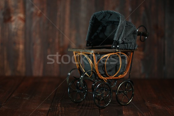 Baby Cradle on Grunge Wooden Background Stock photo © tobkatrina