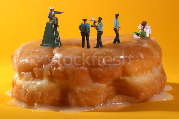 Police Officers in Conceptual Food Imagery With Donuts Stock photo © tobkatrina