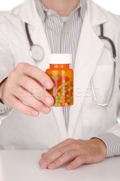 Doctor With Medication in Prescription Bottles Stock photo © tobkatrina