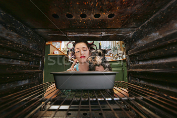 Vintage Housewife Smoking and Cooking Dinner Stock photo © tobkatrina