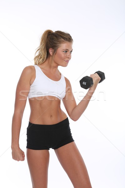 Happy Young Woman Working Out and Doing Fitness Activities Stock photo © tobkatrina