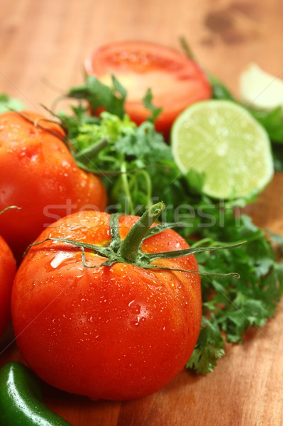 Tomatoes on a Rustic Wood Plank Stock photo © tobkatrina