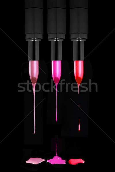 Dripping Lipsticks on a Black Background Stock photo © tobkatrina