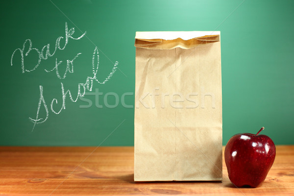 School Lunch Sack Sitting on Teacher Desk Stock photo © tobkatrina