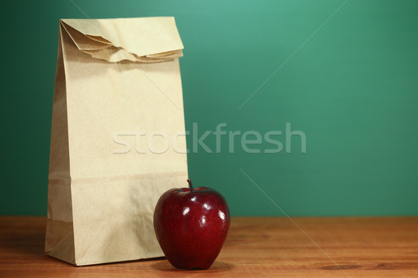 School Lunch Sack Sitting on Teacher Desk Stock photo © tobkatrina