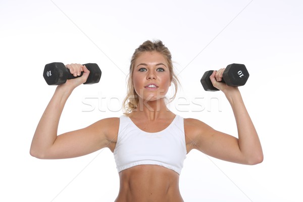 Happy Young Woman Working Out and Doing Fitness Activities Stock photo © tobkatrina