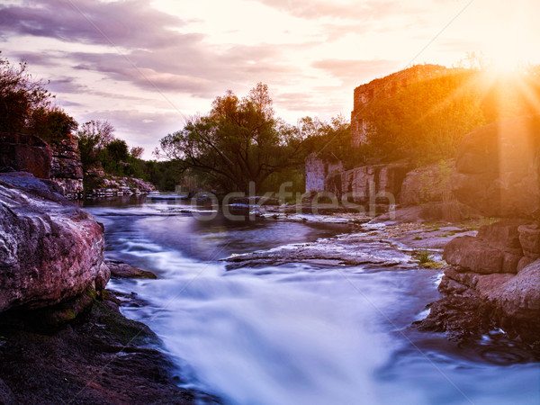 Summer evening on the mountain river with old palace ruines on b Stock photo © tolokonov