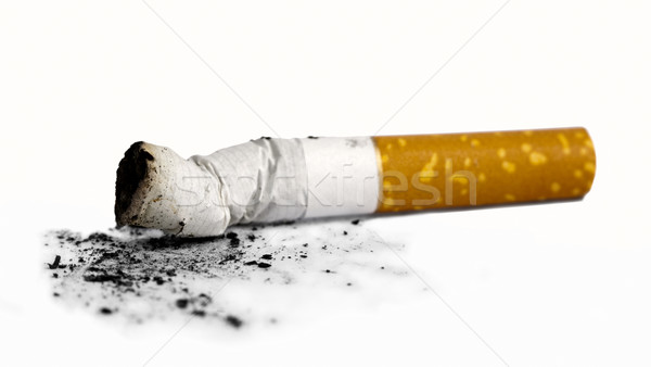 Cigarette butt with ash over white background Stock photo © tolokonov