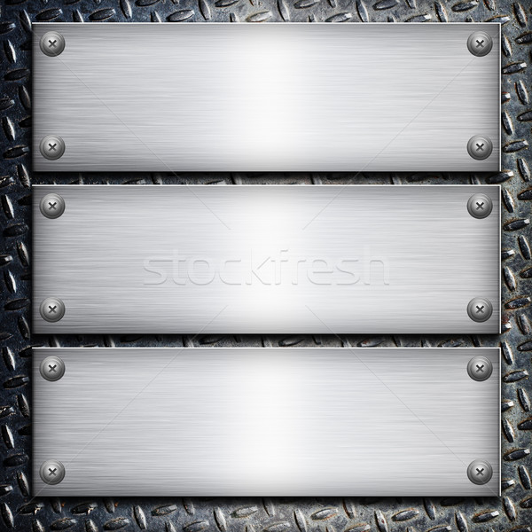 Brushed steel plate over black metall background for your design Stock photo © tolokonov