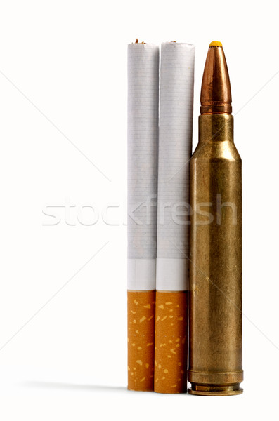 real violence. Two cigarettes close to bullet with drop shadow Stock photo © tolokonov