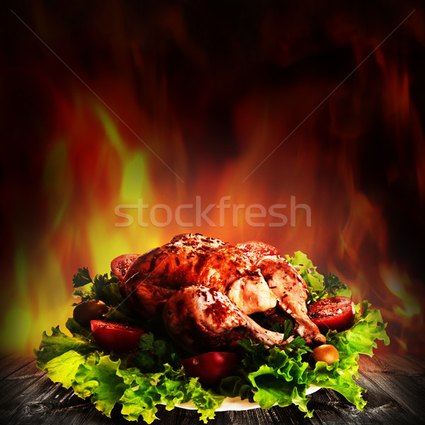 Grilled chicken over salad on the wooden desk Stock photo © tolokonov