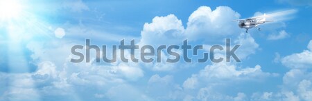 Blue skies with bright sun and airplane as abstract backgrounds Stock photo © tolokonov