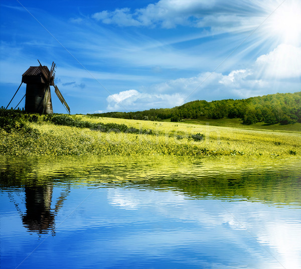 Green hills under the blue summer skies Stock photo © tolokonov