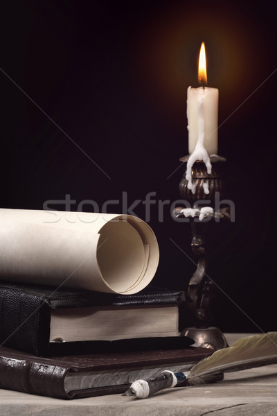 Art still life  with burning candle over old wooden desk Stock photo © tolokonov