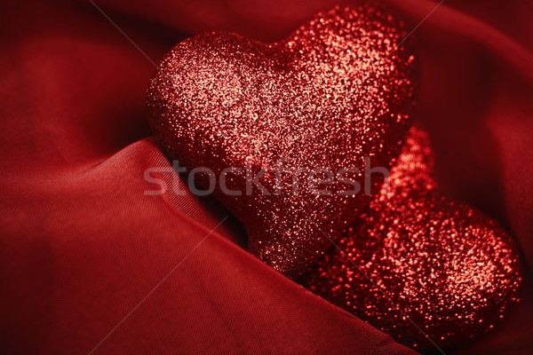 abstract Valentine's backgrounds over red textile with tho heart Stock photo © tolokonov