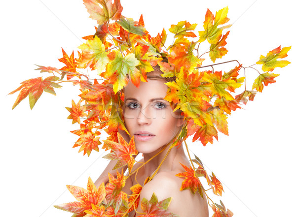 Beautiful woman wrapped in autumn leafs Stock photo © tommyandone