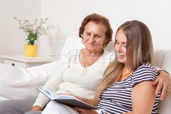 Carer spending time with an elderly woman Stock photo © tommyandone