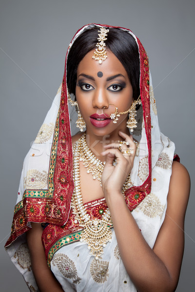 Young Indian woman in traditional clothing with bridal makeup and jewelry Stock photo © tommyandone