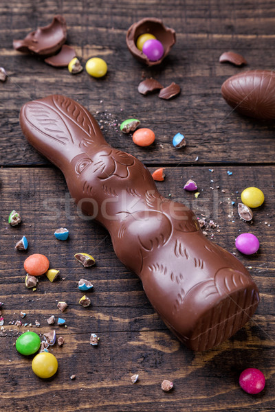 Chocolate easter eggs and sweets on wooden background Stock photo © tommyandone