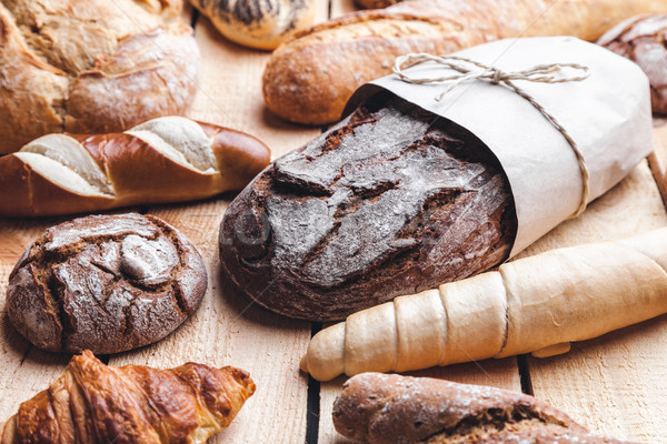 Delicious fresh bread on wooden background Stock photo © tommyandone